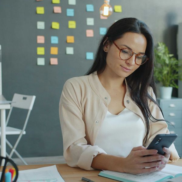 A businesswoman reading about AI news