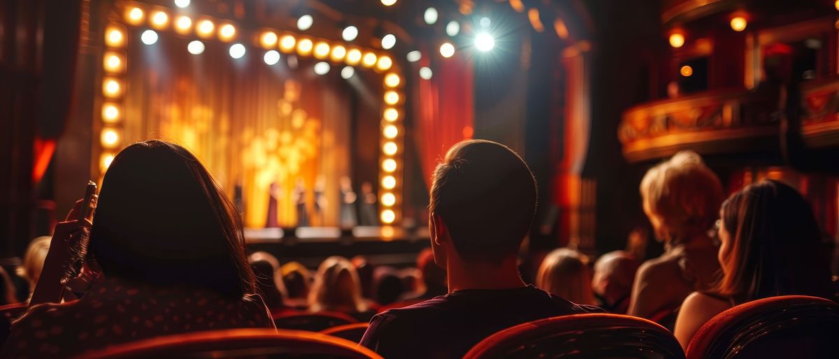 A couple attending a Broadway musical