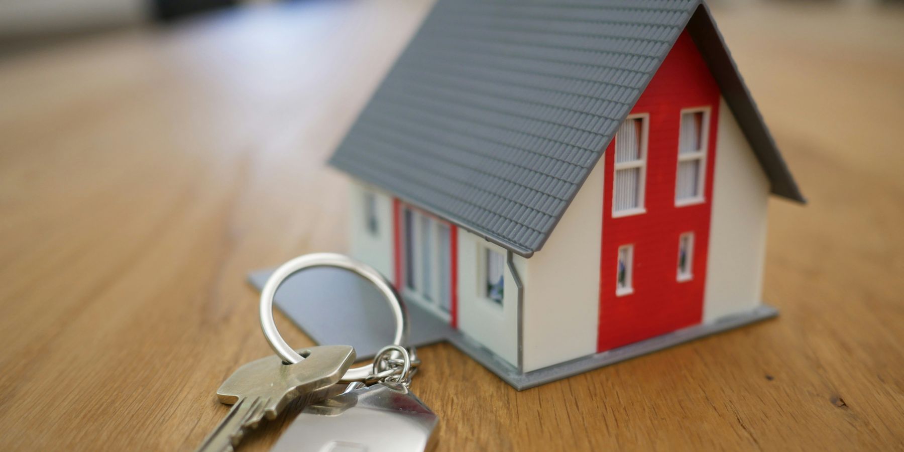 A house and keys representing home buying and mortgages