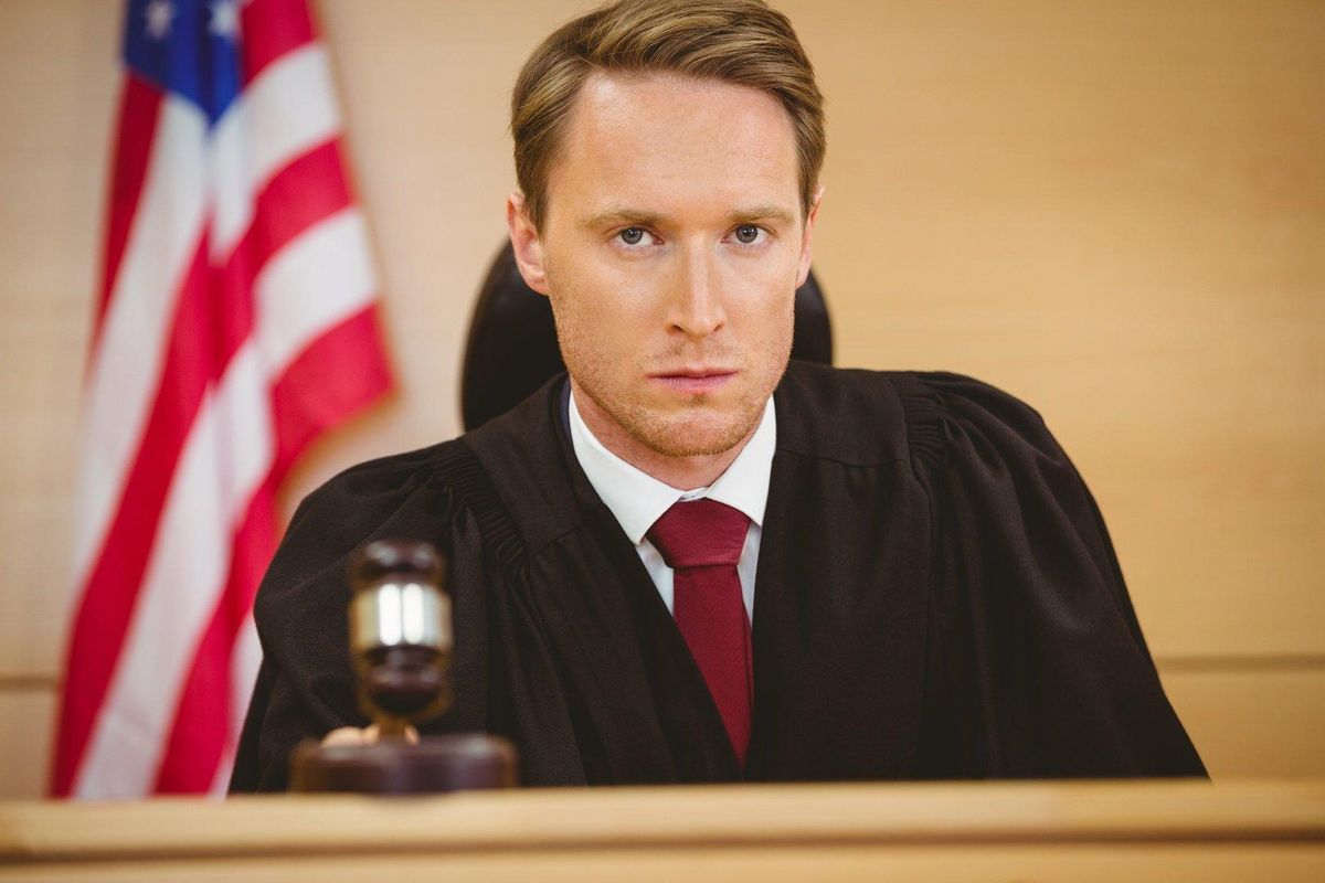 a judge about to bang gavel