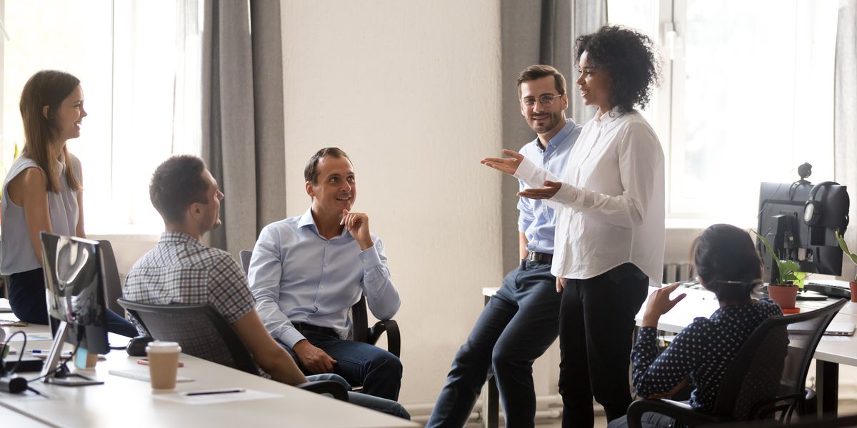 A leader speaking to their business team