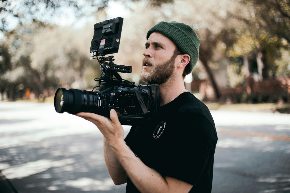 A man doing videography as a side hustle