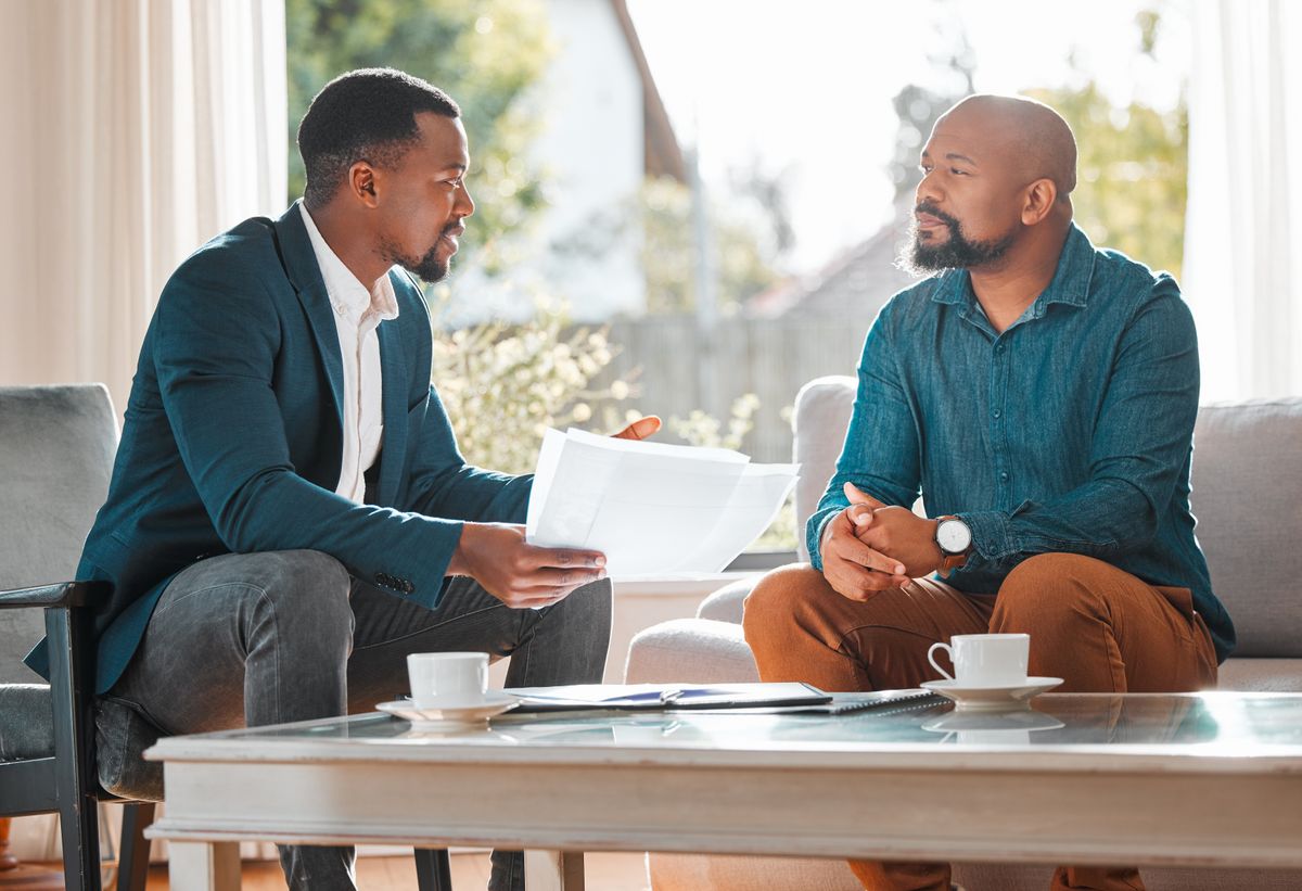 A small business owner and customer meeting in person to build trust