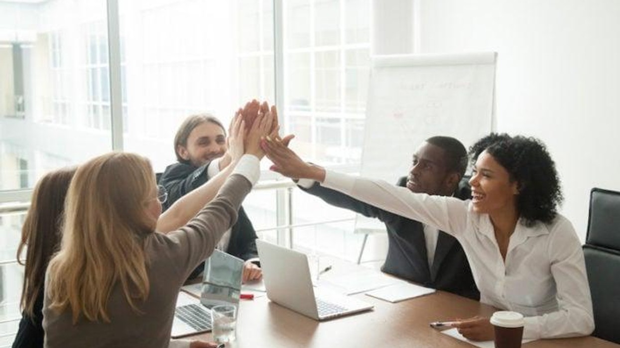 A team celebrates a successful collaboration