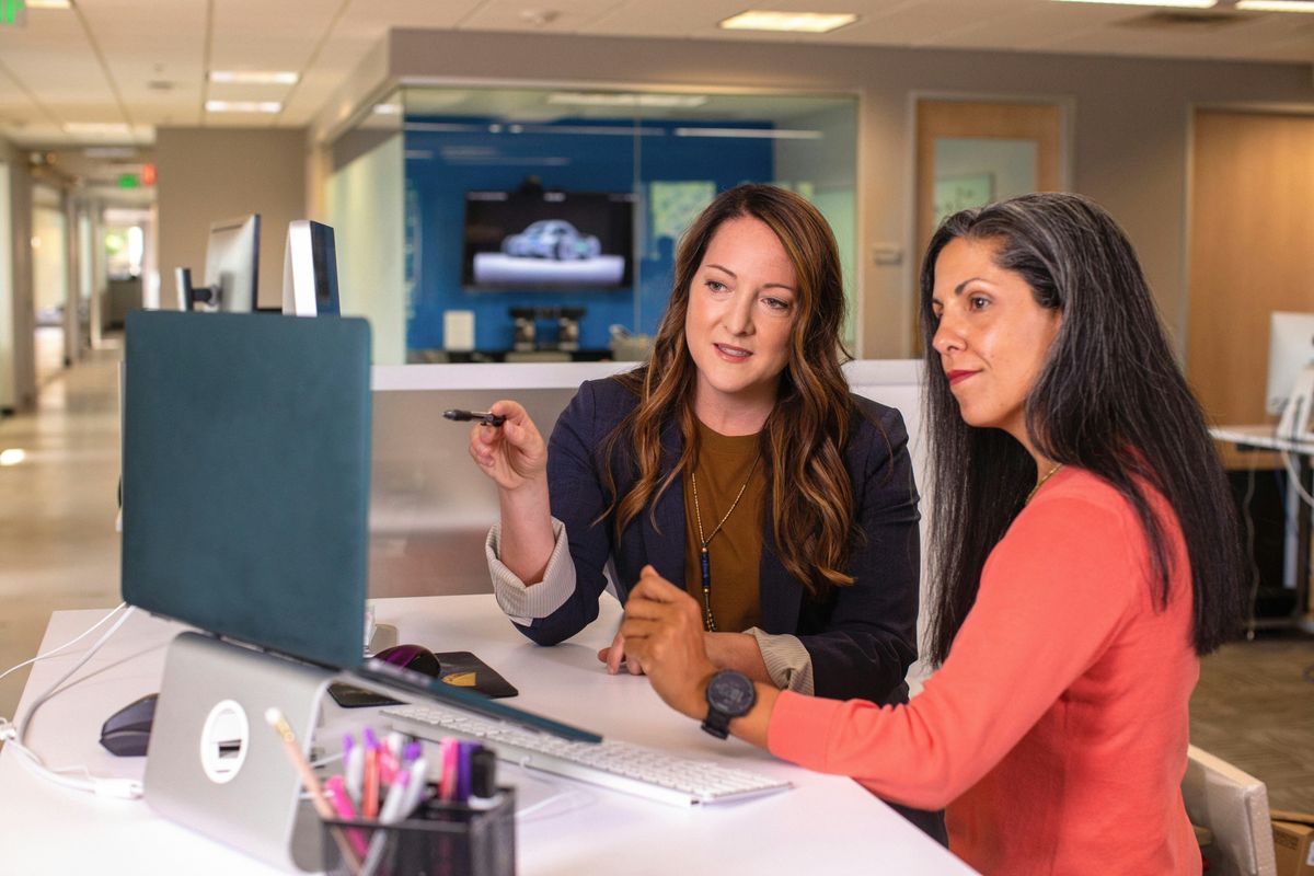 An authentic leader talks to an employee