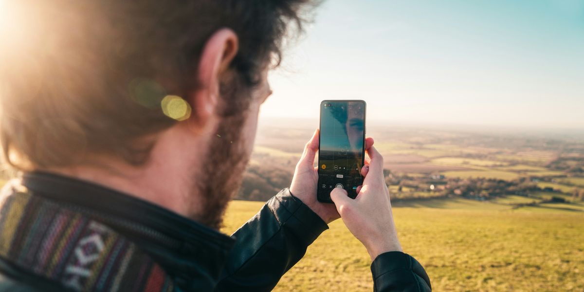An influencer taking a selfie for social media