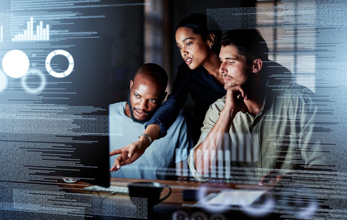 An on-site tech team working with their manager