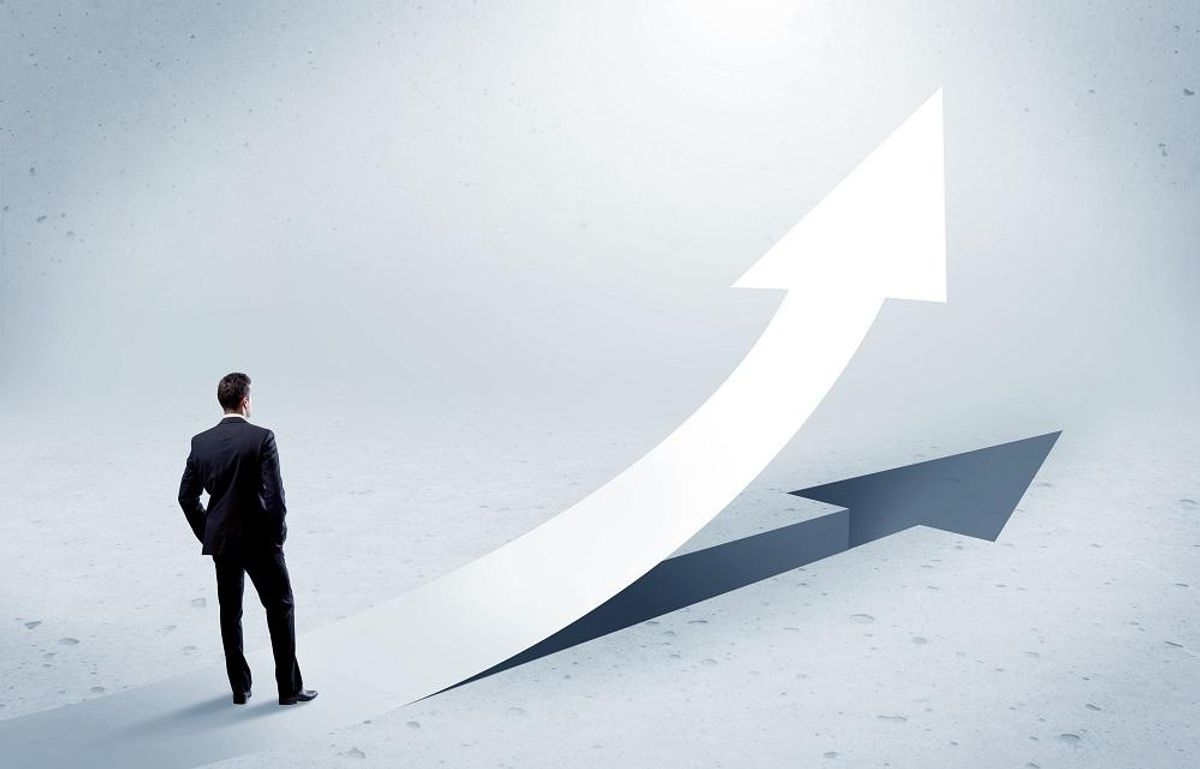 Arrow pointing up with standing businessman