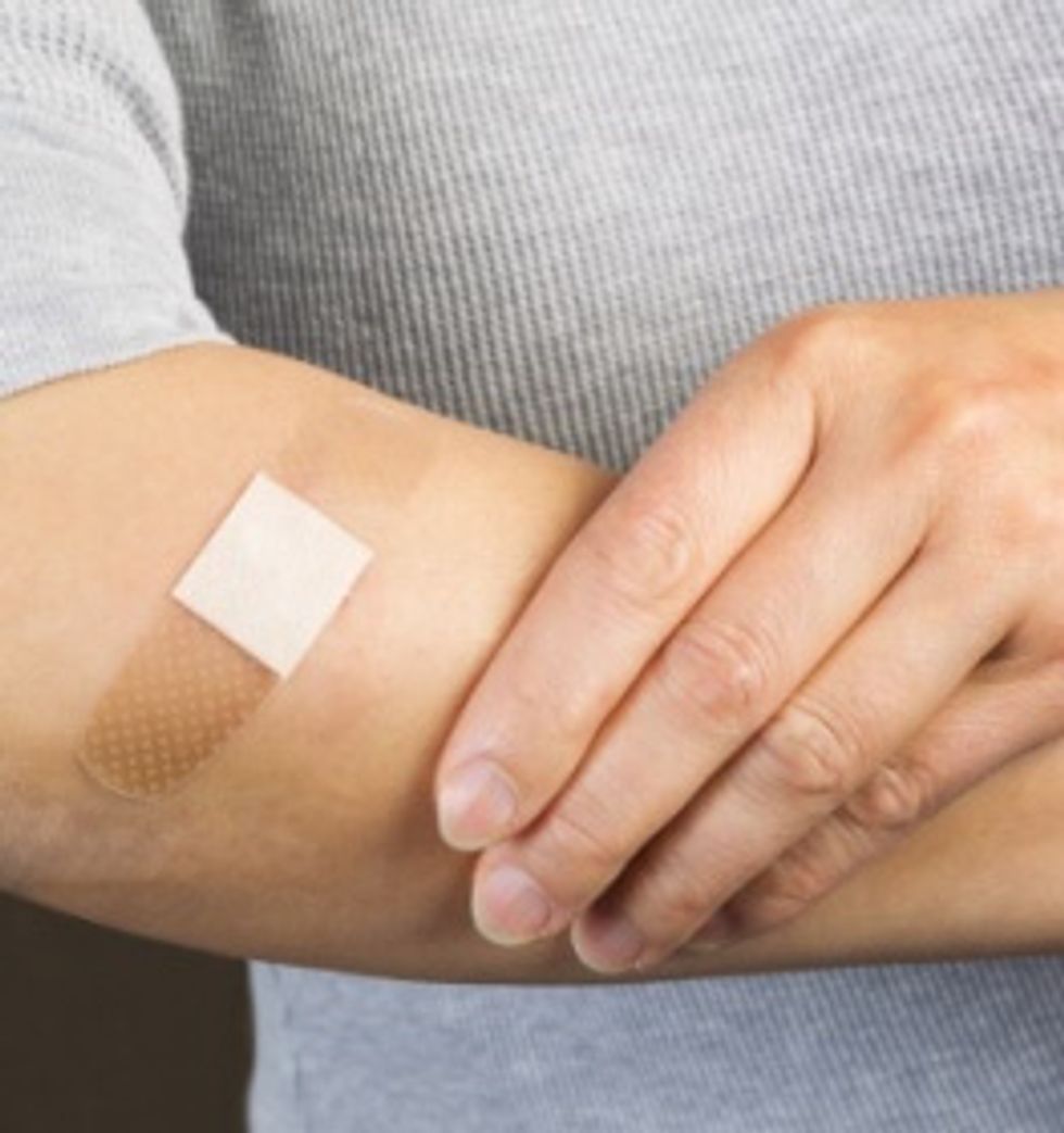 Bandage over Cut on Arm