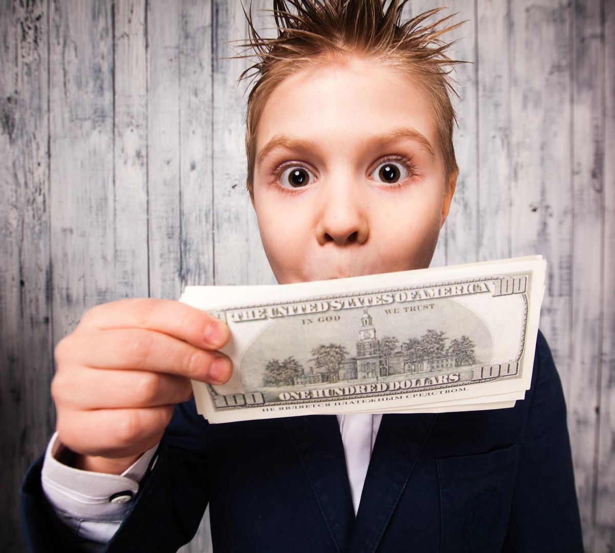 boy with dollar bills