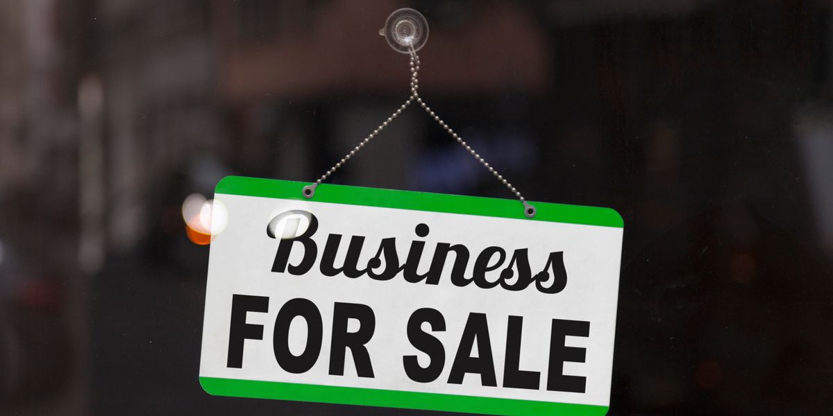 Business for sale sign in a window