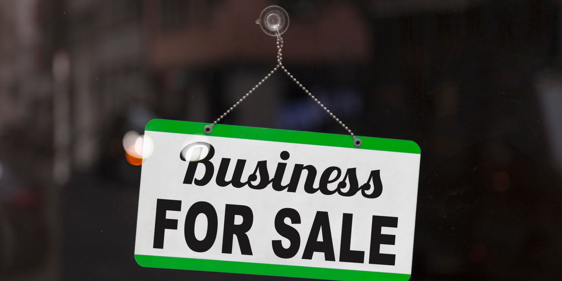 Business for sale sign in a window