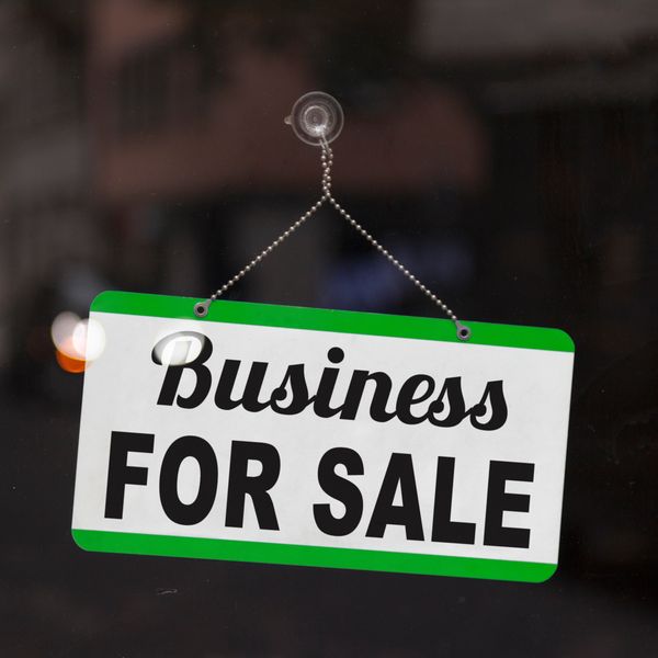 Business for sale sign in a window