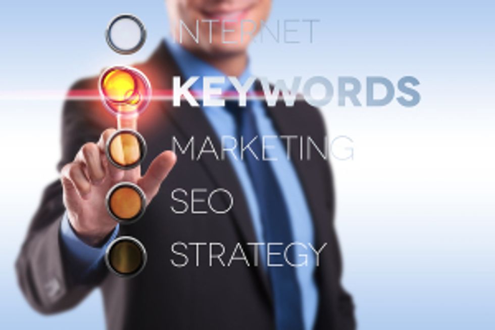 business man choosing the keywords option on a digital screen