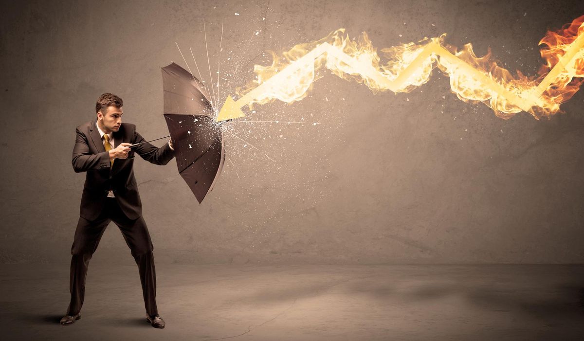 Business man defending himself from a fire arrow