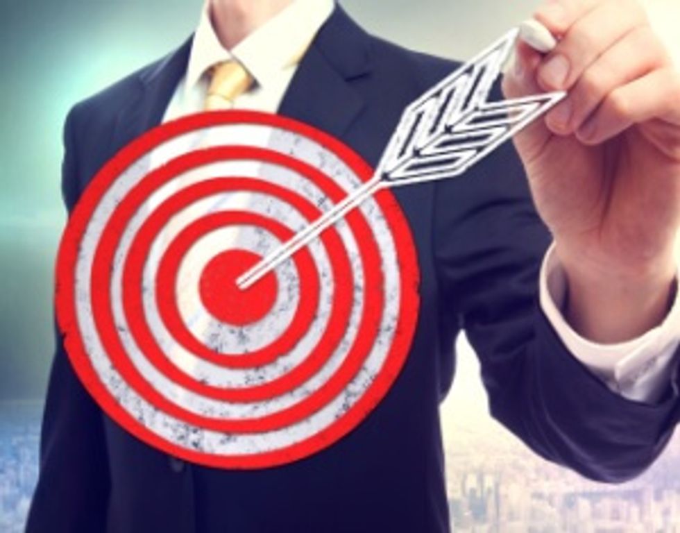 Business man drawing target