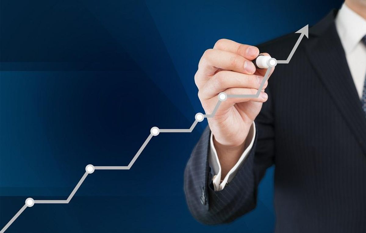 Business man increasing efficiency of his company