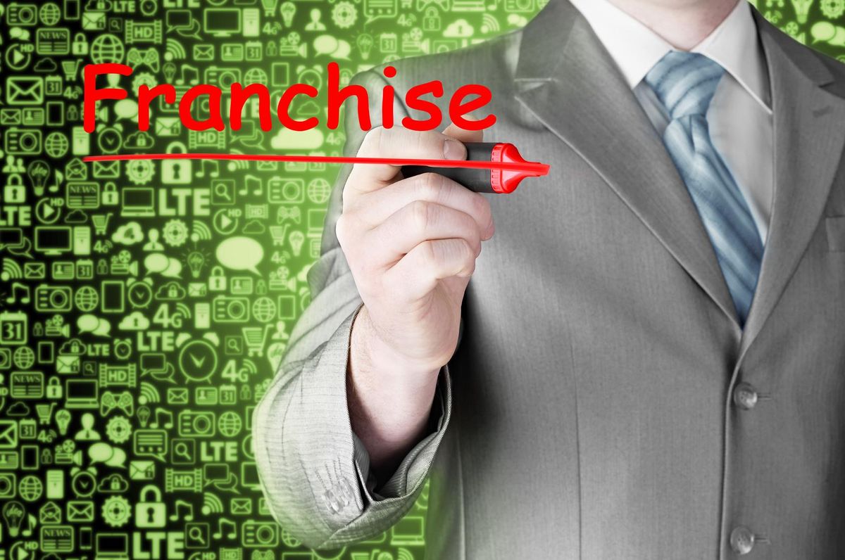 business man writing franchise