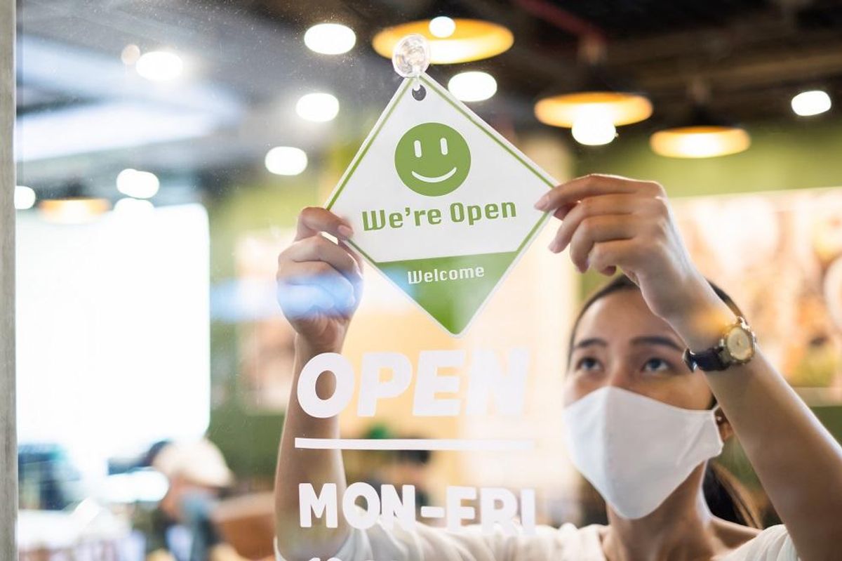Business owner wear protective face mask