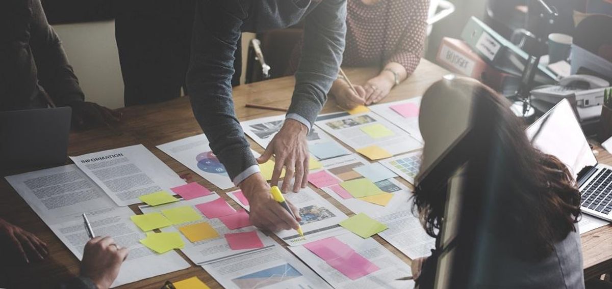 Business people planning strategy as part of spring cleaning their business