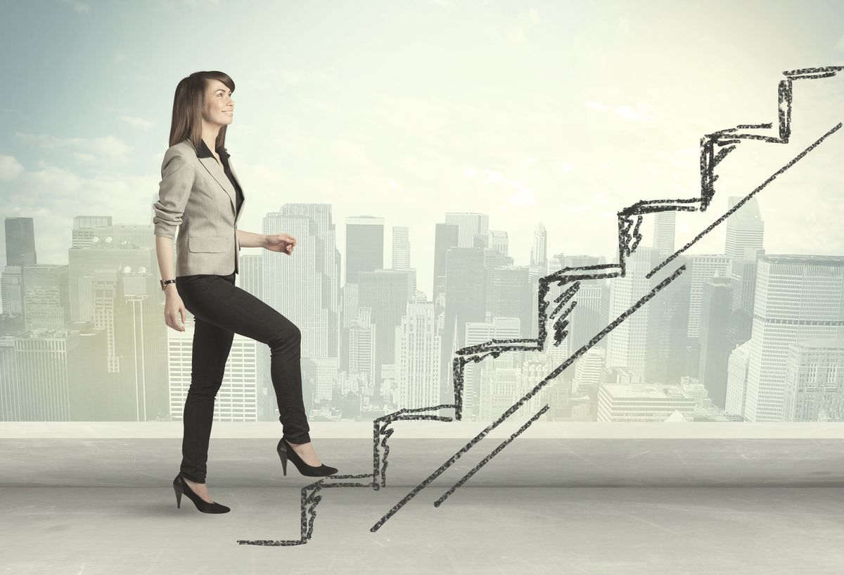 Business woman climbing steps