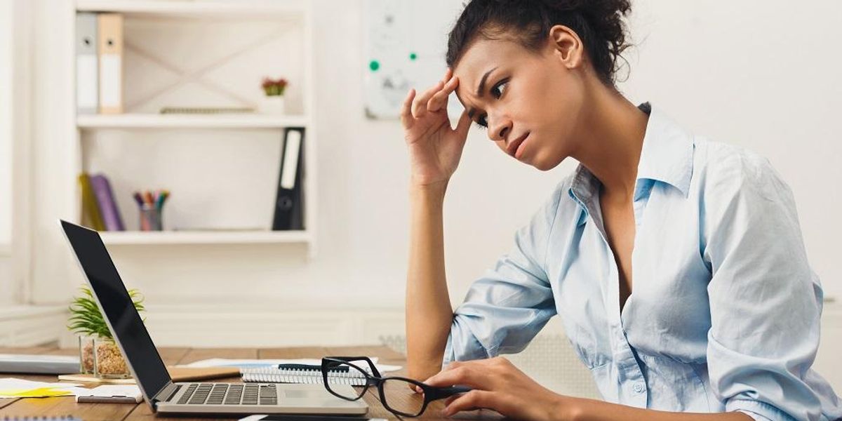 Business woman is frustrated but taps into emotional intelligence