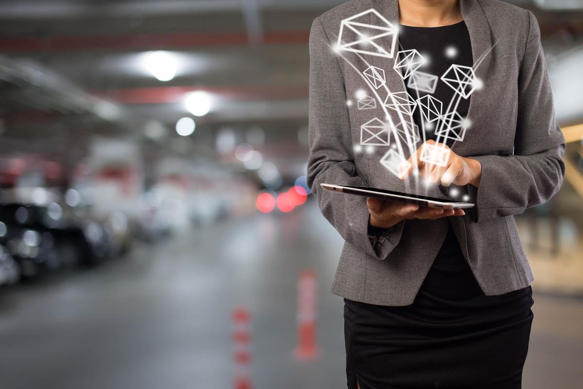 Business woman sending email