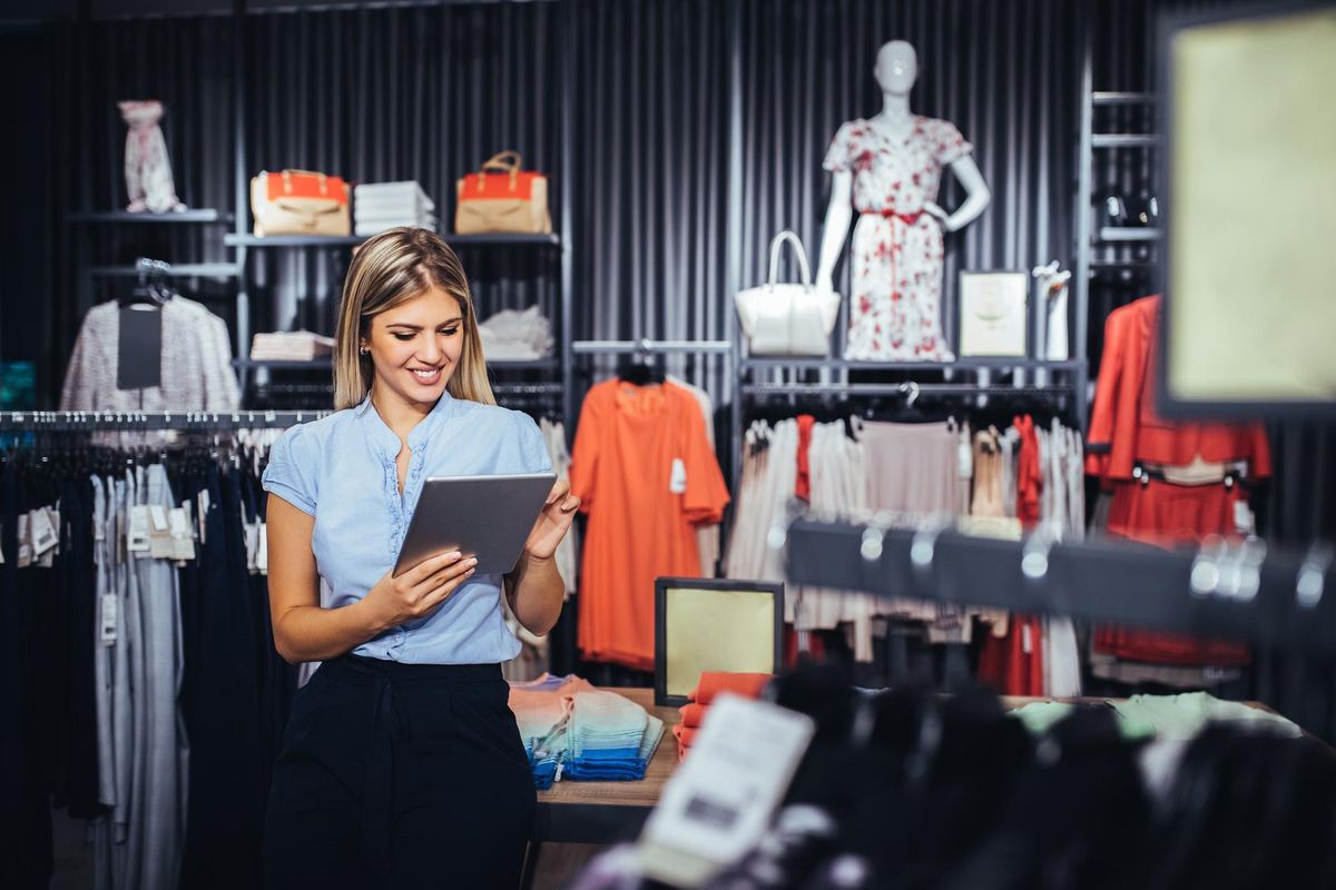 business woman using digital tablet in a store.