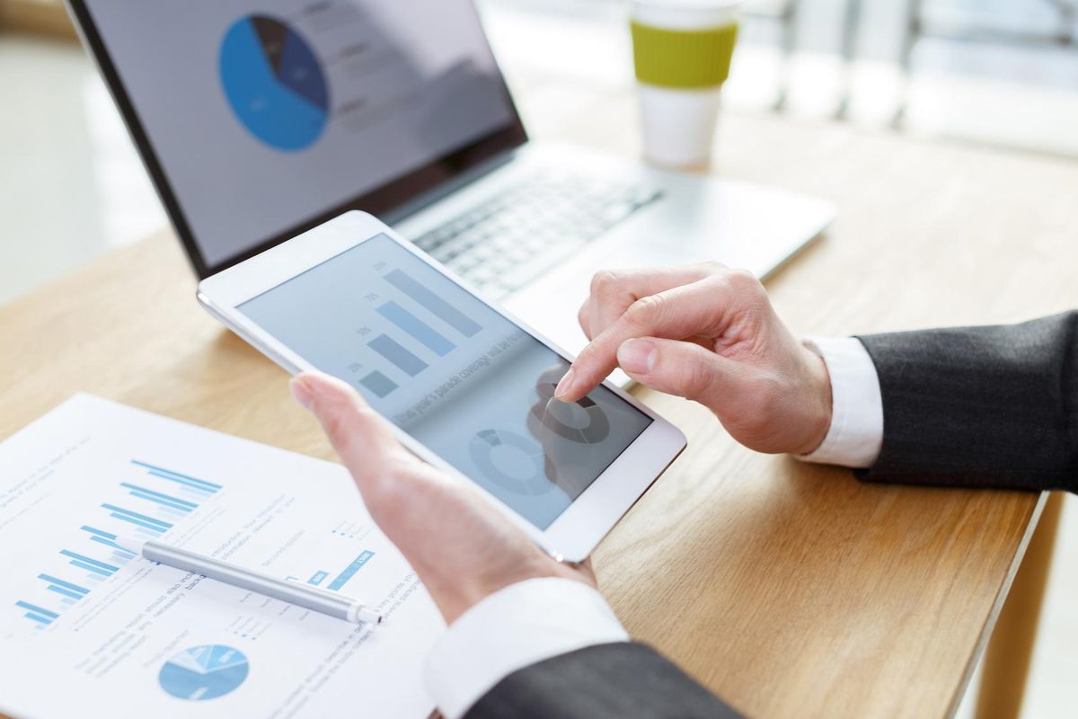businessman checking financial reports