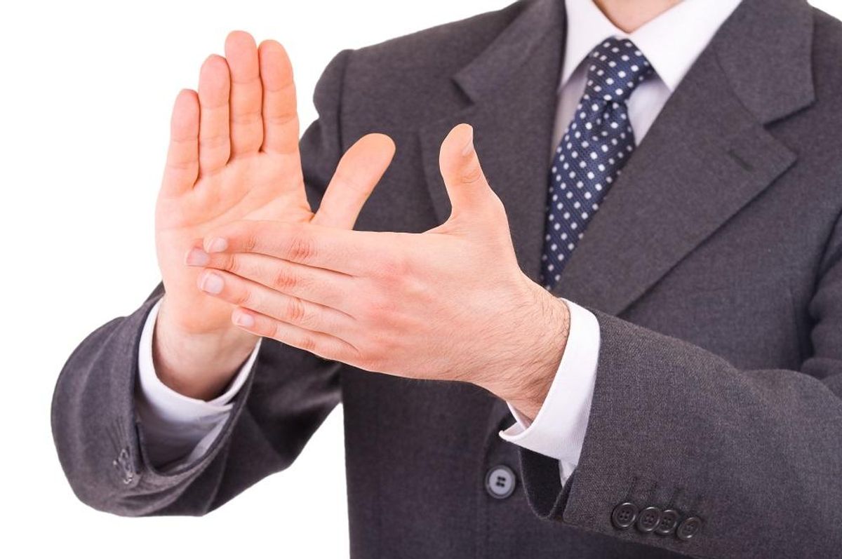 Businessman clapping his hands