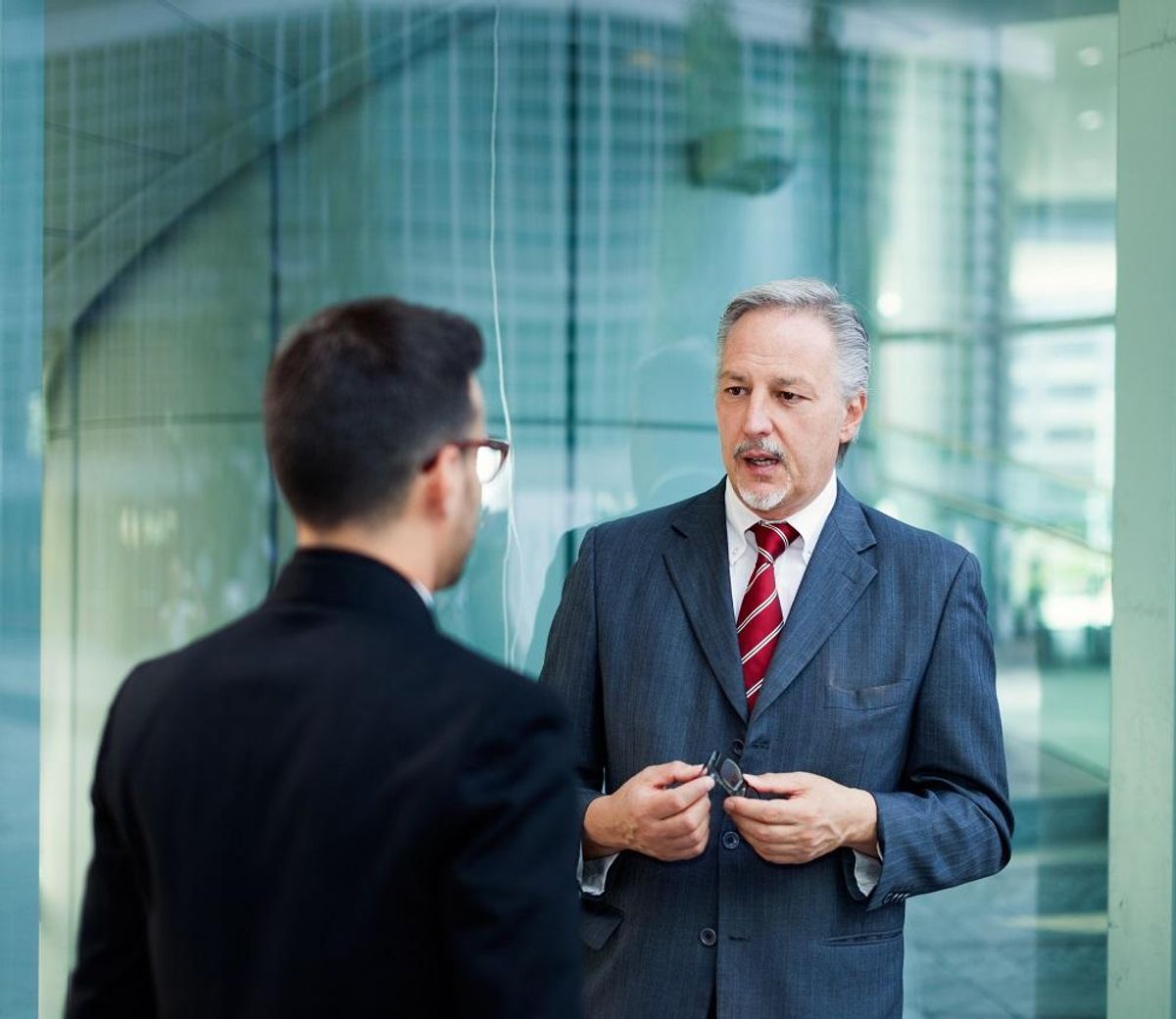 Businessman giving feedback to employee