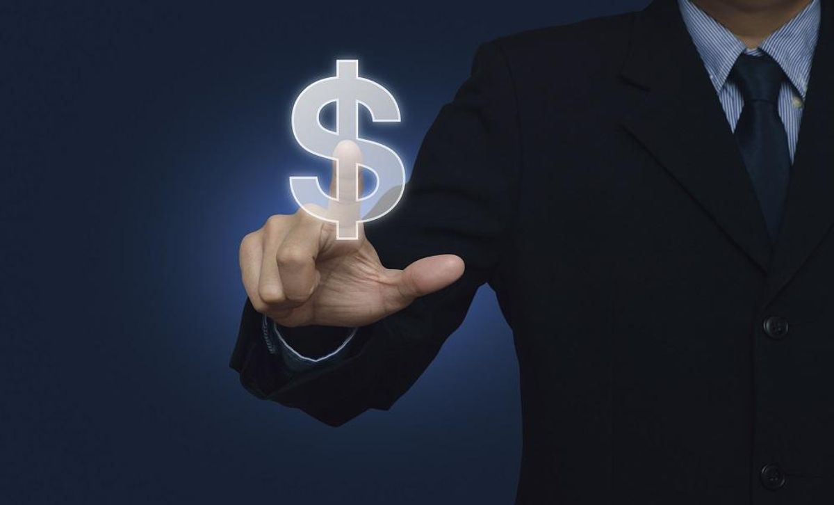 Businessman hand pushing dollar currency icon