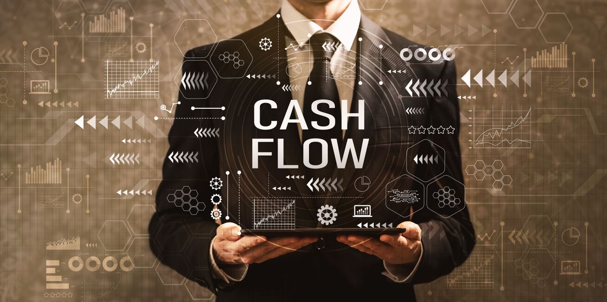 Businessman holding icon representing cash flow optimization