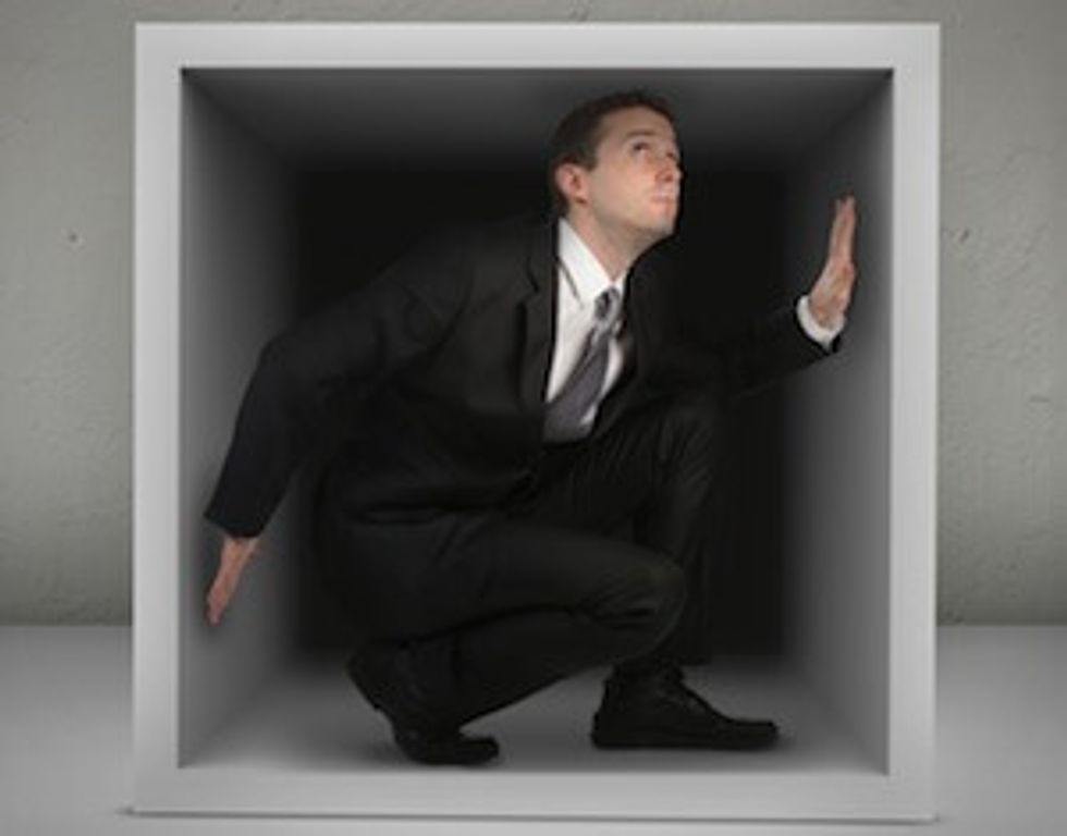 businessman in box: think outside box when starting a business