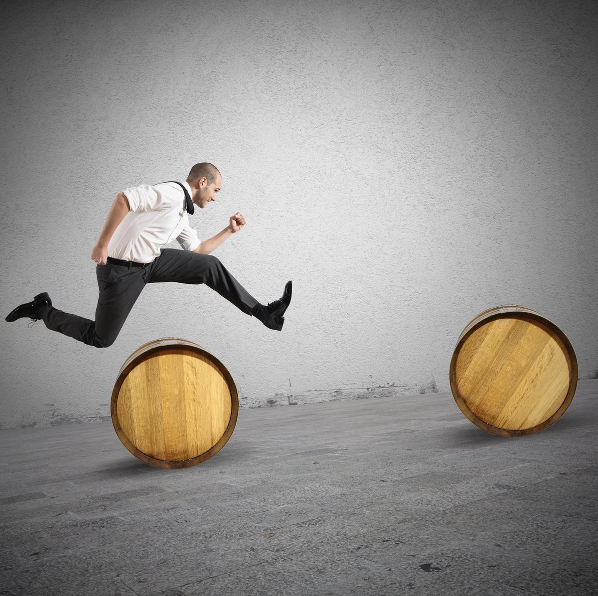 businessman jumping obstacles