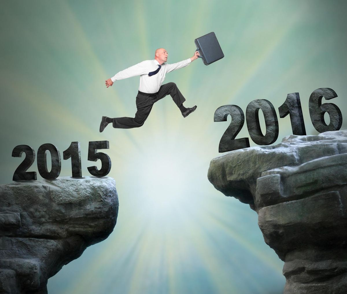 Businessman jumps to The New Year 2016