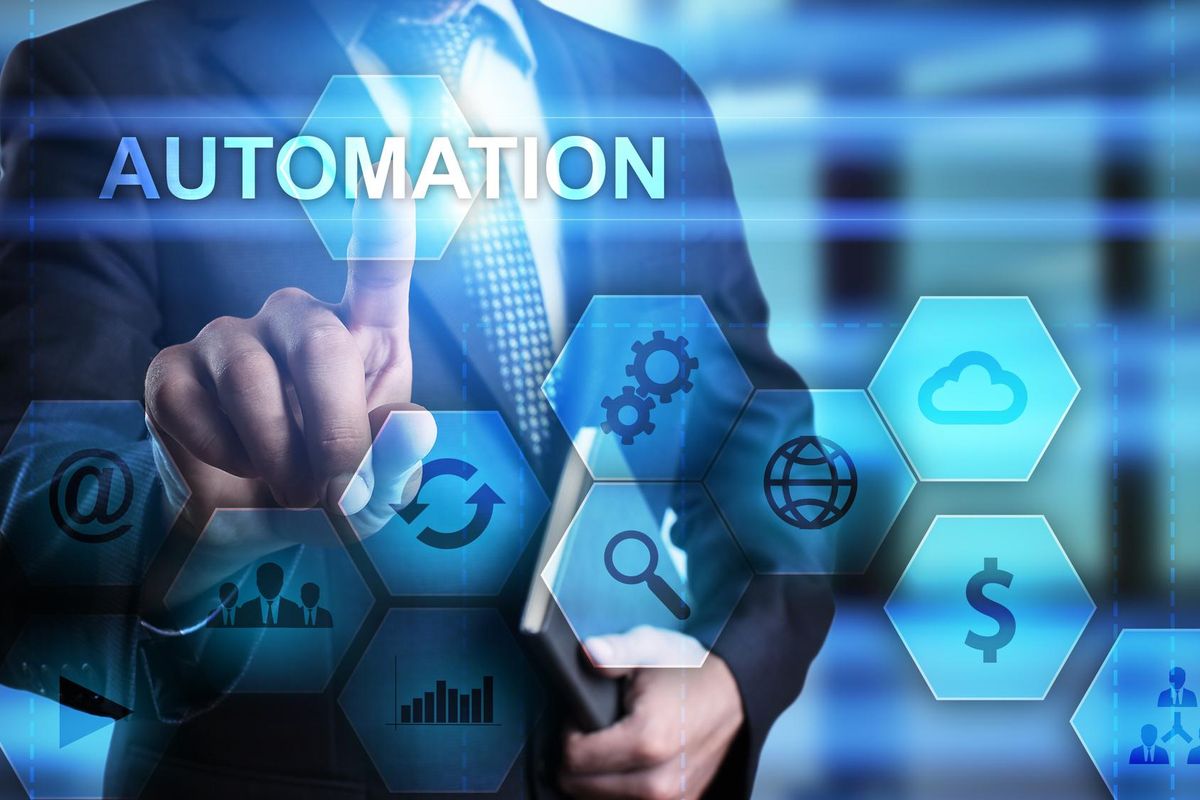 Businessman pressing automation button