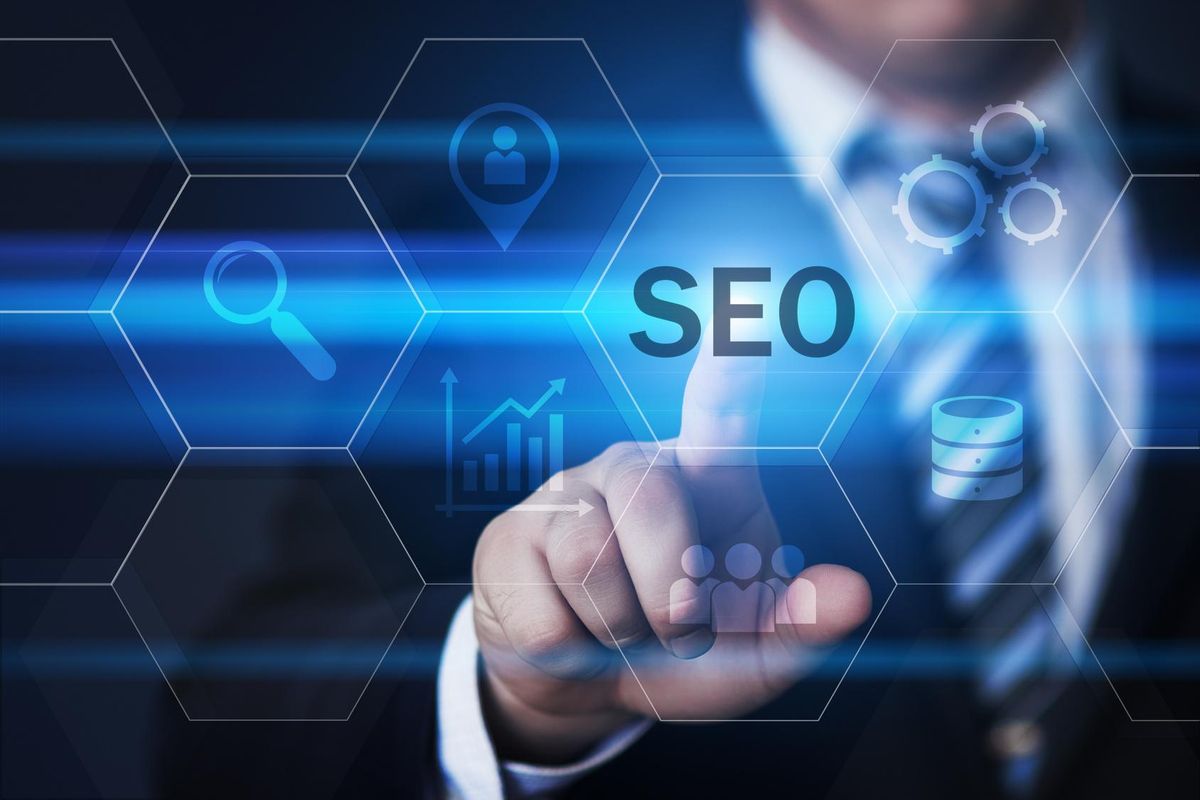 businessman pressing SEO button on virtual screen