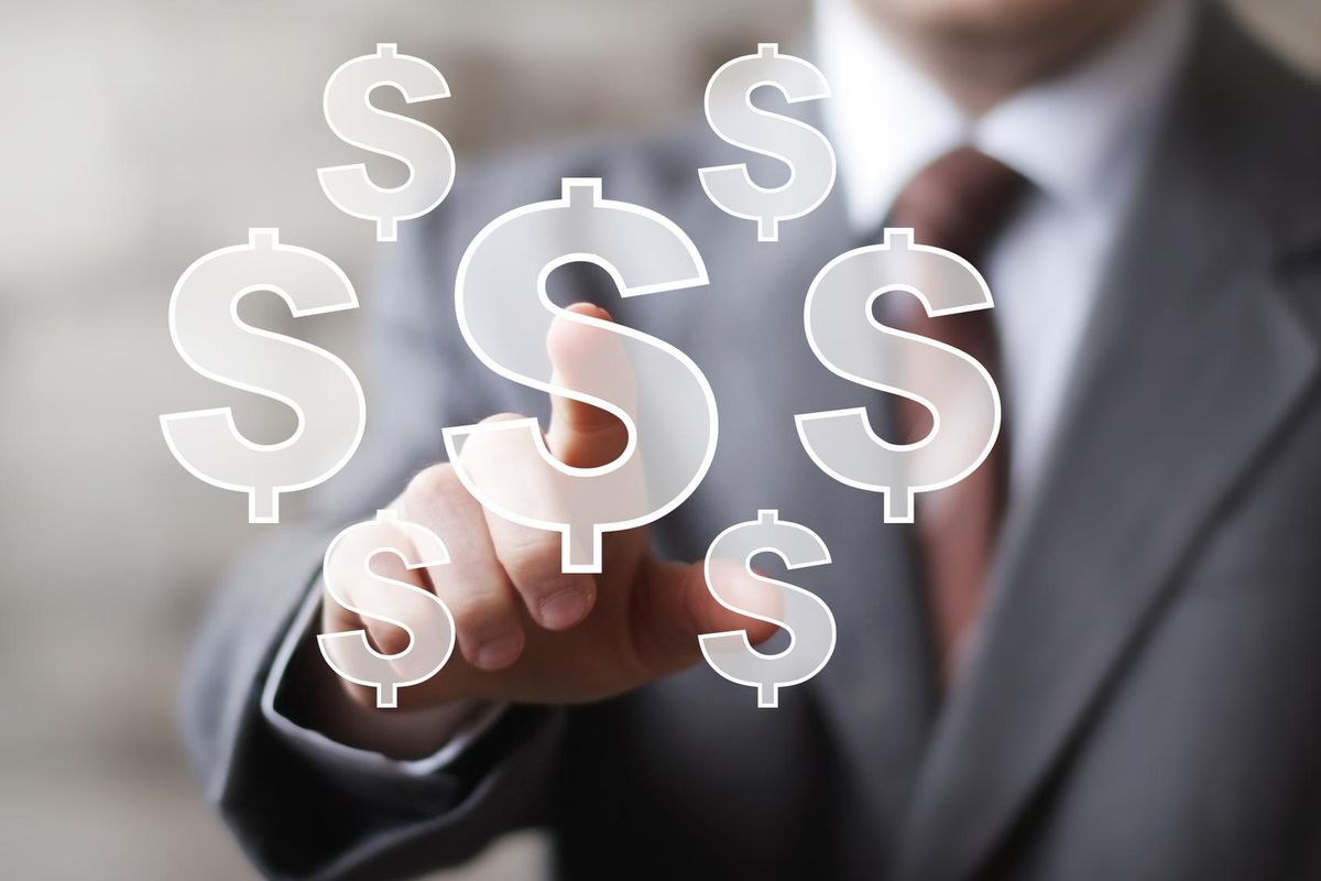 Businessman pushing button icon with dollar currency sign