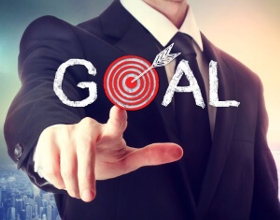 businessman reaching leadership goal