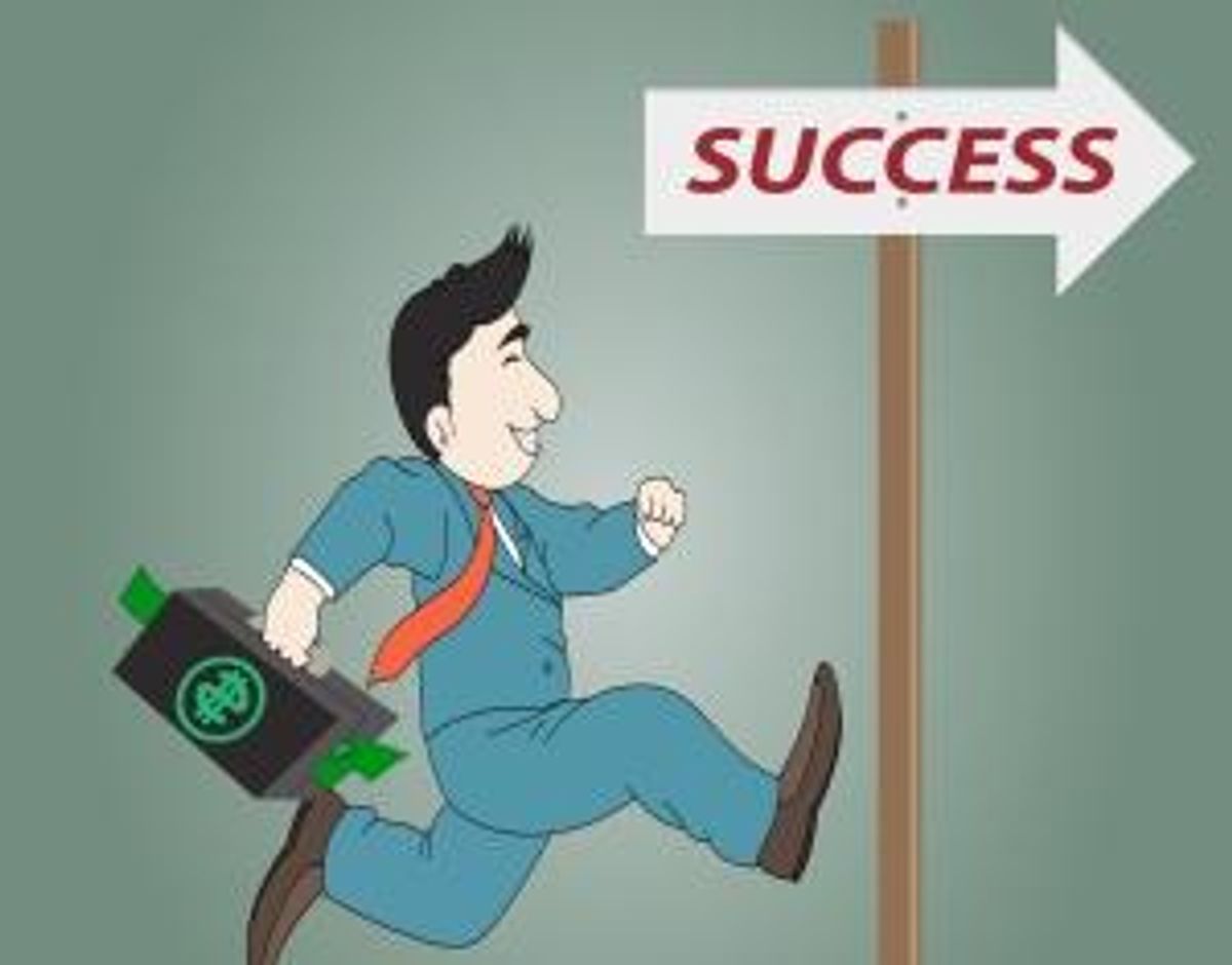 Businessman running toward successful sign