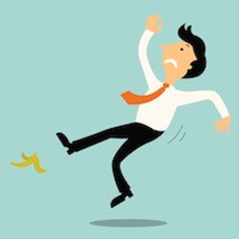 businessman slipping on banana peel