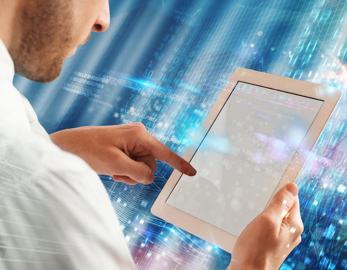 Businessman touching the screen of a tablet