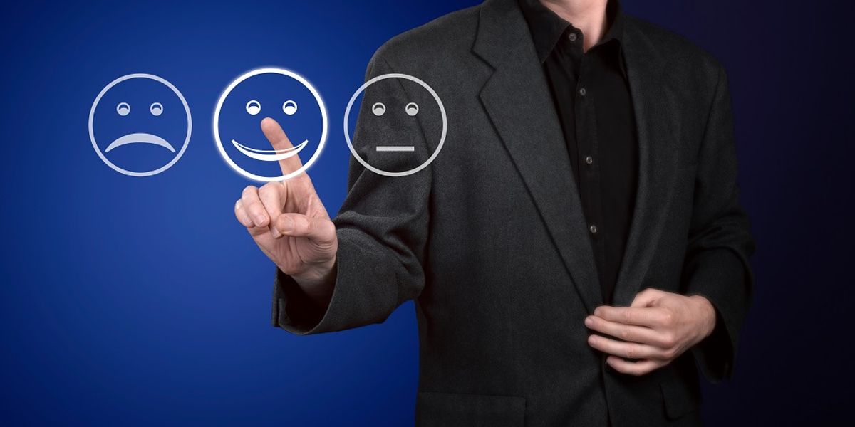 Businessman with a great last impression touching screen of evaluation form.