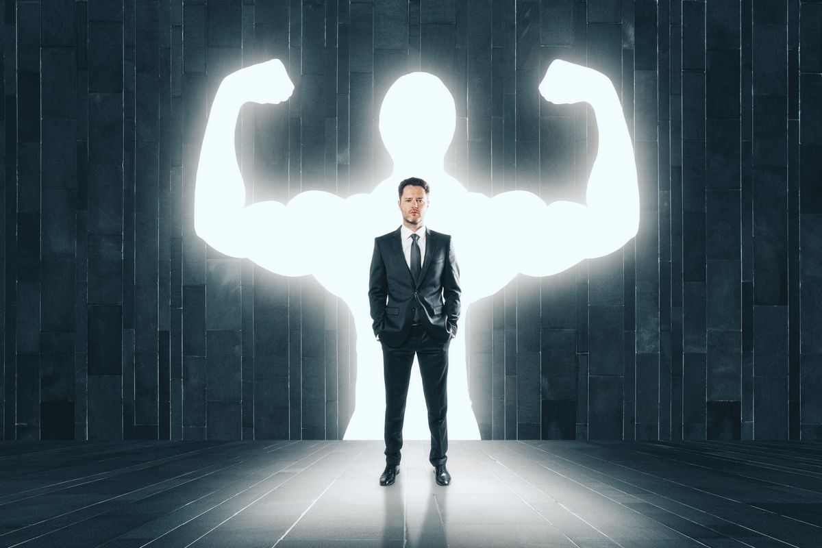 Businessman with muscly arms to symbolize resilience