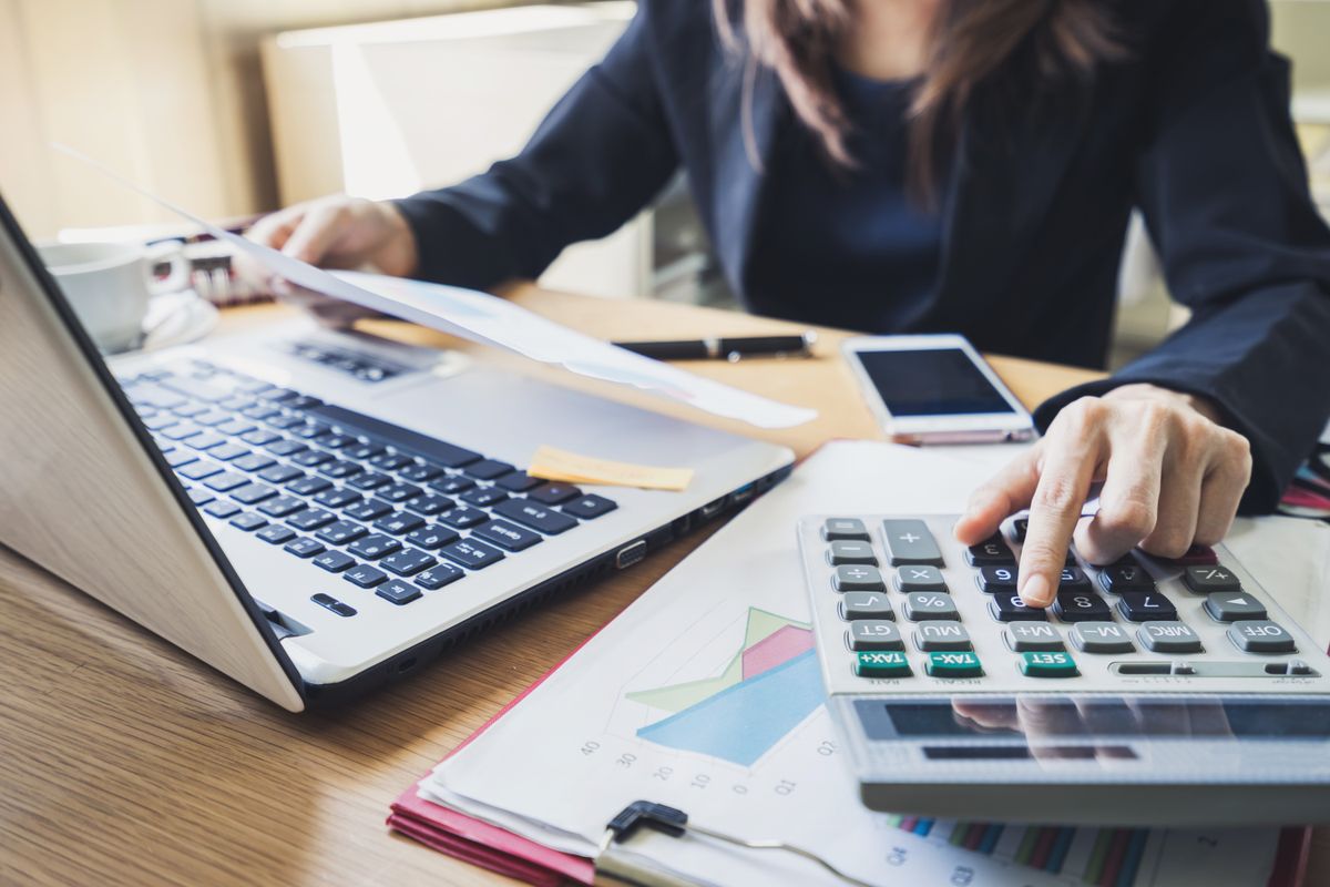 Businessman working on financial reporting in preparation for scaling