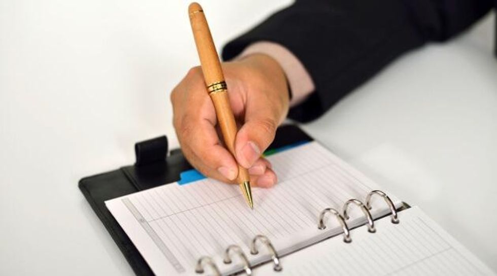 businessman writing