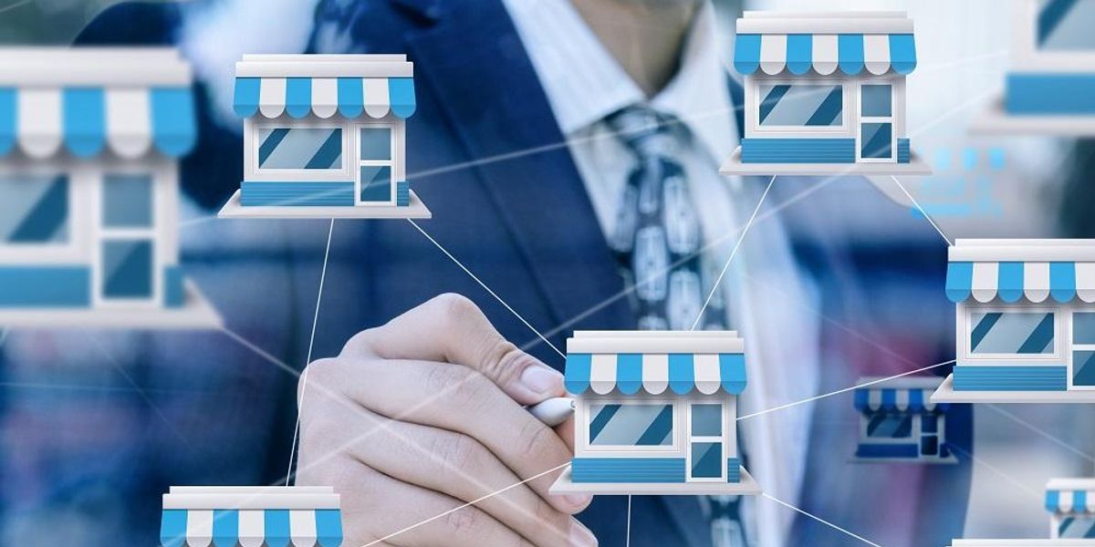 Businessmen considering franchised businesses