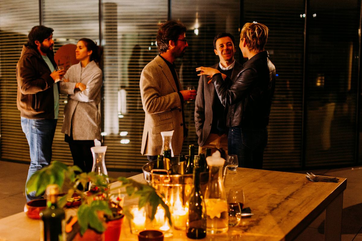 Businesspeople networking with drinks
