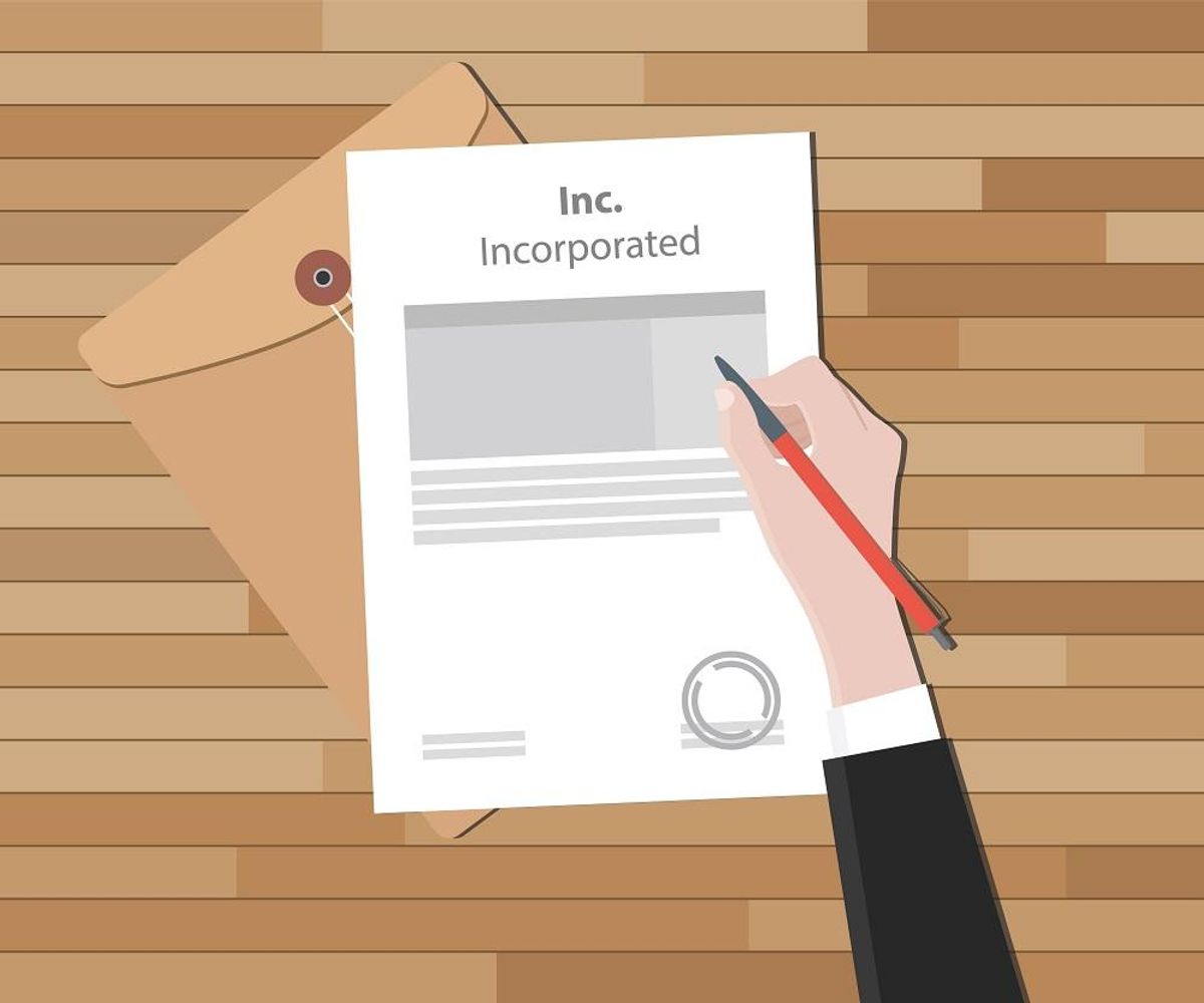 Businessperson signing papers of incorporation